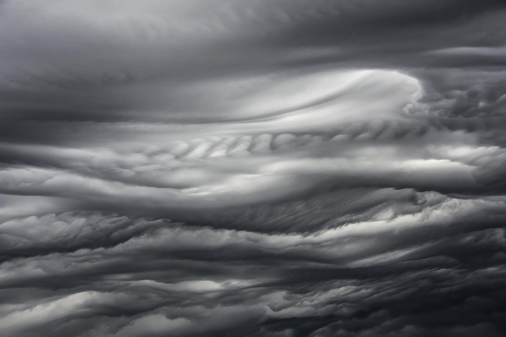 A mesmerizing view of dark, swirling clouds capturing the essence of a stormy atmosphere.